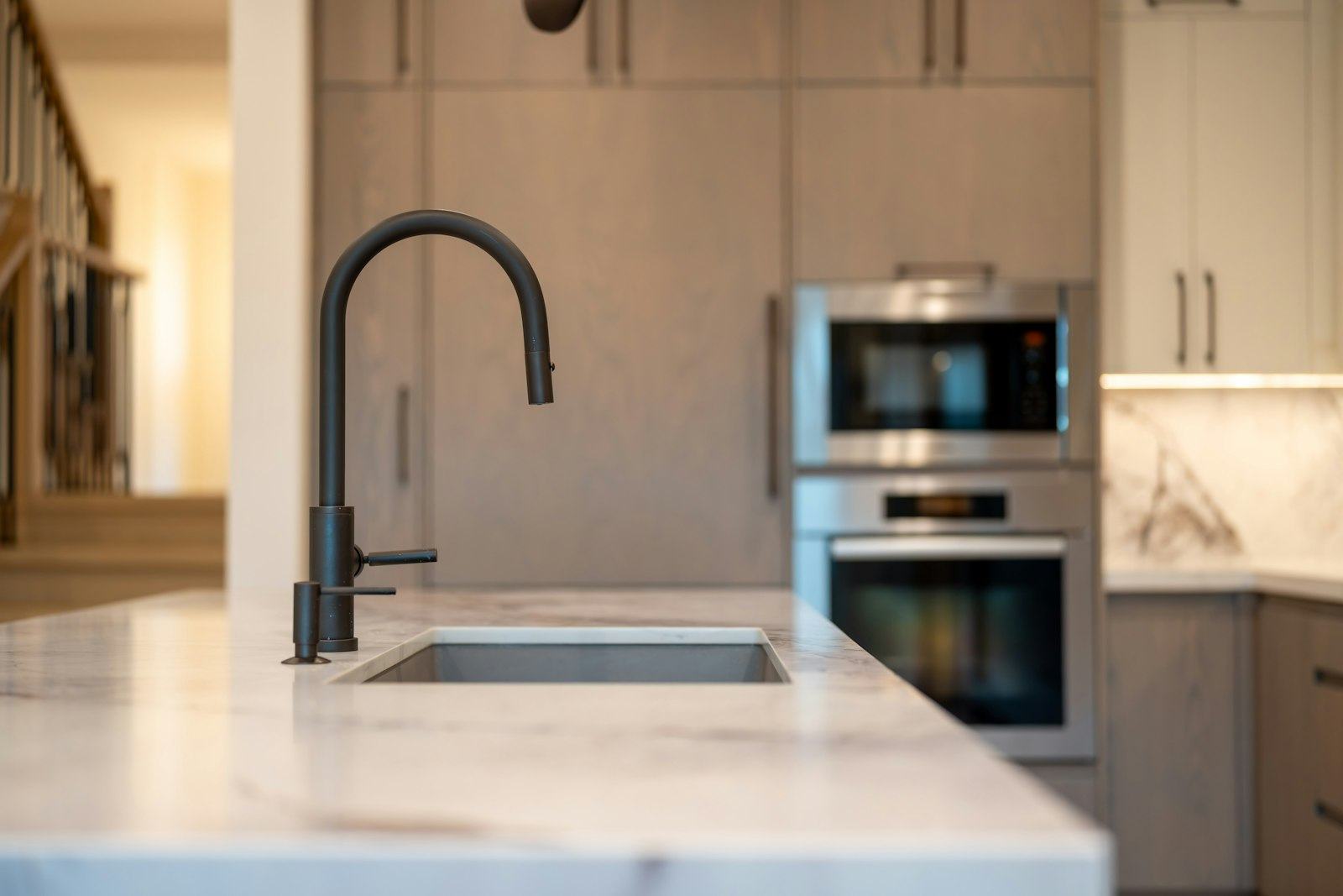 Remodeled kitchen with a black faucet